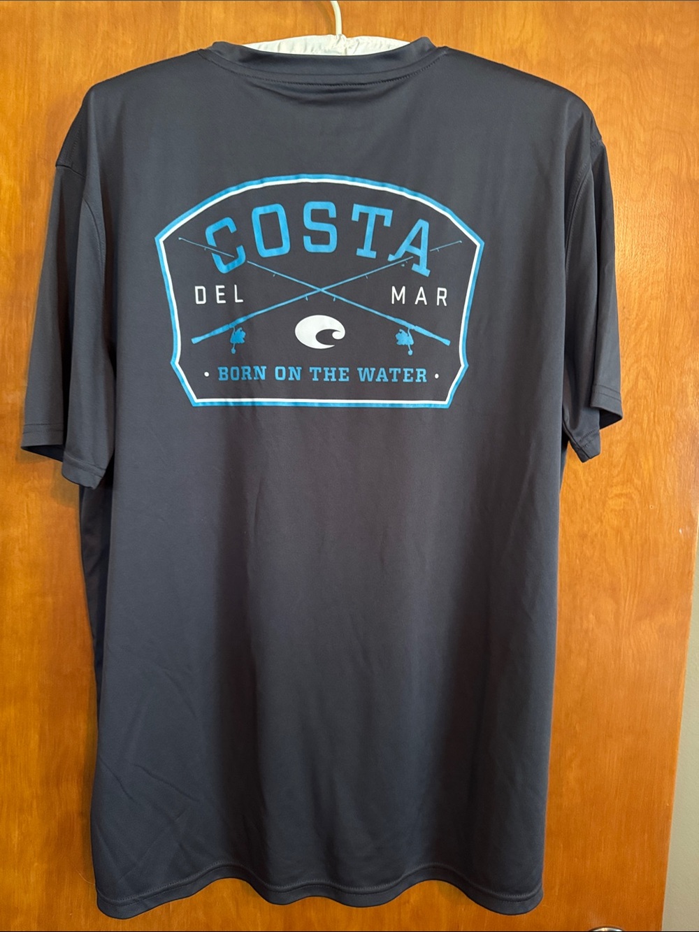 Costa Short-Sleeve Performance Sun Shirt in Charcoal with Light Blue Logo
